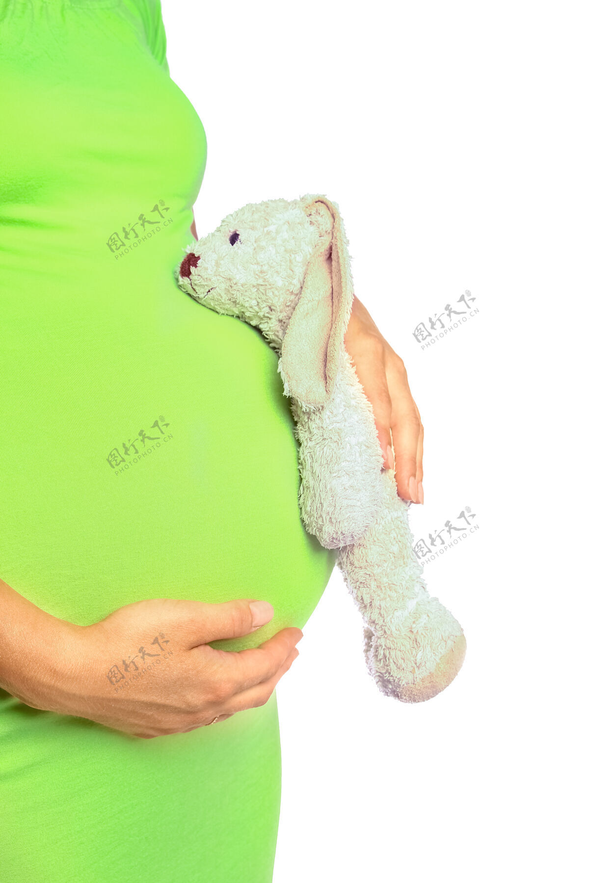 身体快乐的怀孕女孩躺在白色的背景上成人怀孕肚子