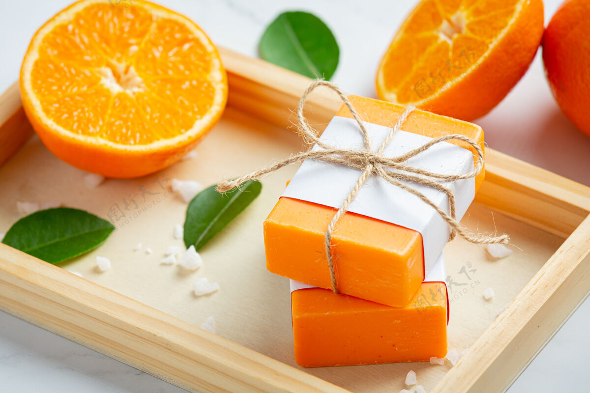 肥皂橙色肥皂和新鲜的橙色大理石背景酒吧浴缸皮肤护理